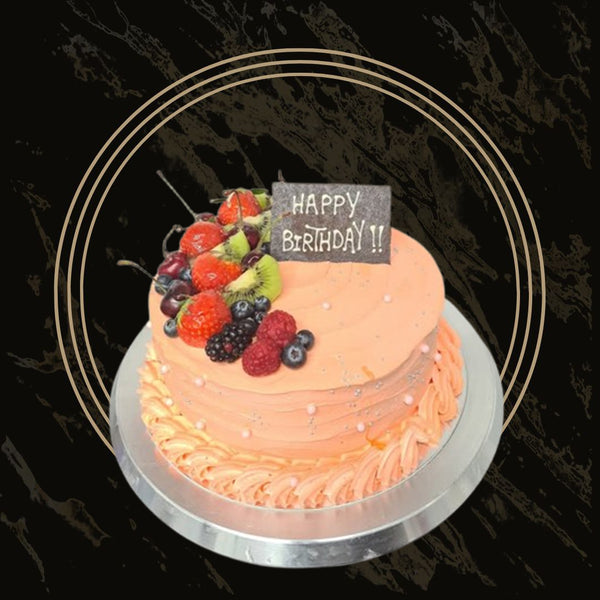 Fun birthday cake with balloon-themed decorations and pastel frosting from The Bakers Shop in Birmingham