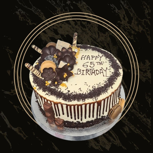 Colorful birthday cake with rainbow sprinkles and buttercream frosting from The Bakers Shop in Birmingham