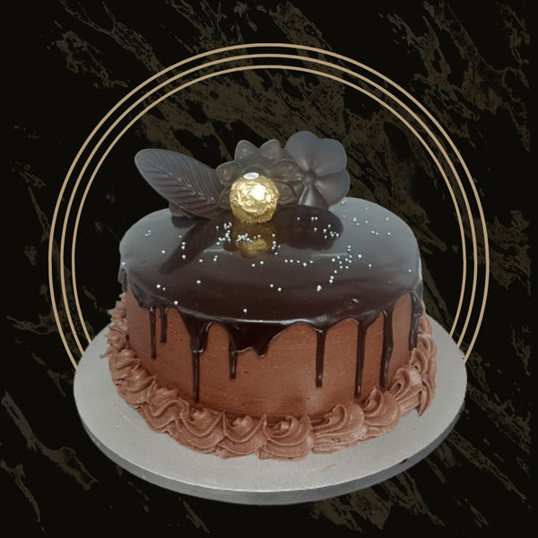 Classic chocolate cake with smooth chocolate frosting from The Bakers Shop in Birmingham
