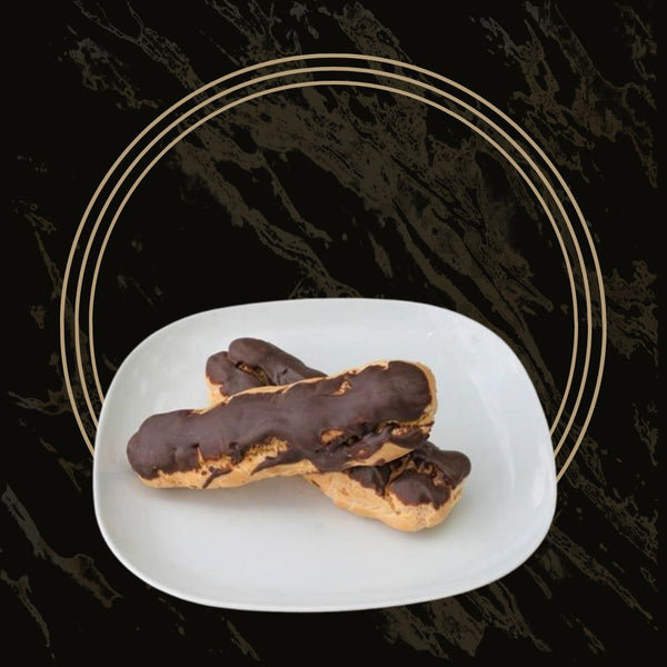 Delicious chocolate eclairs filled with smooth cream and topped with rich chocolate glaze from The Bakers Shop in Birmingham