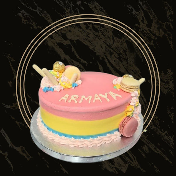 Classic purple and pink celebration cake with floral decorations and elegant layered design from The Bakers Shop in Birmingham