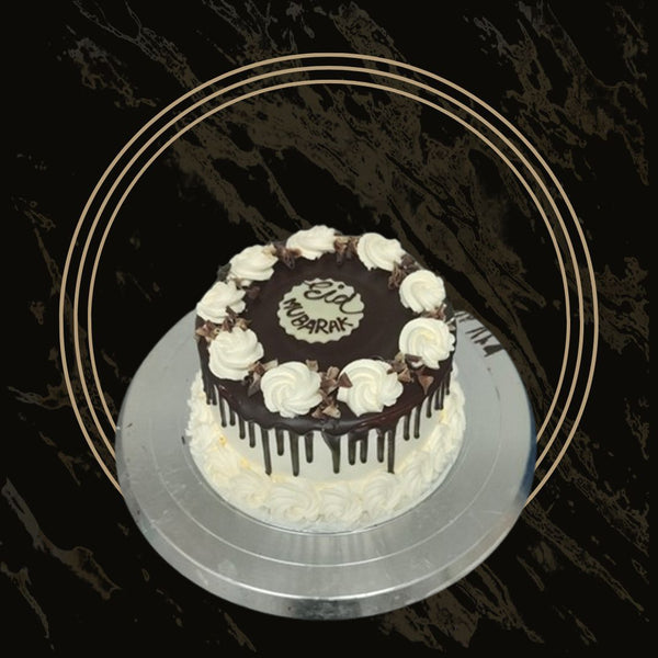 Custom fancy cake with a name topper and delicate piping from The Bakers Shop in Birmingham