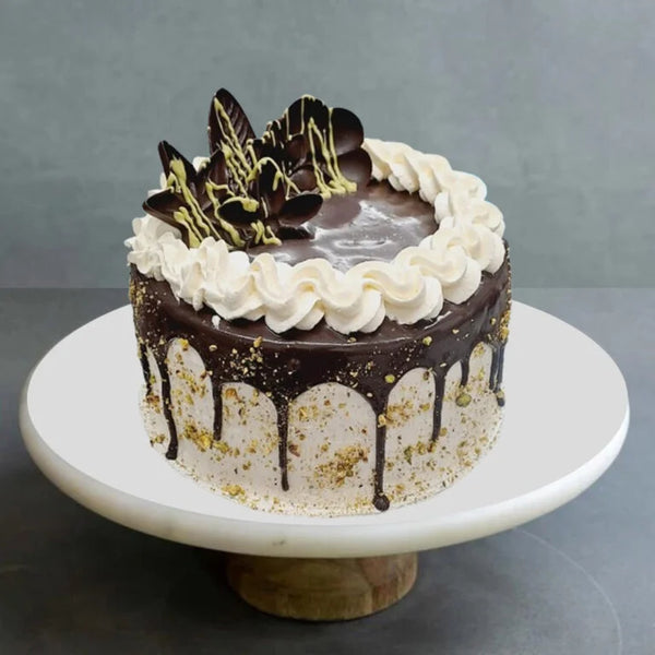 Fancy Easter cake with pastel decorations and festive toppings from The Bakers Shop in birmingham