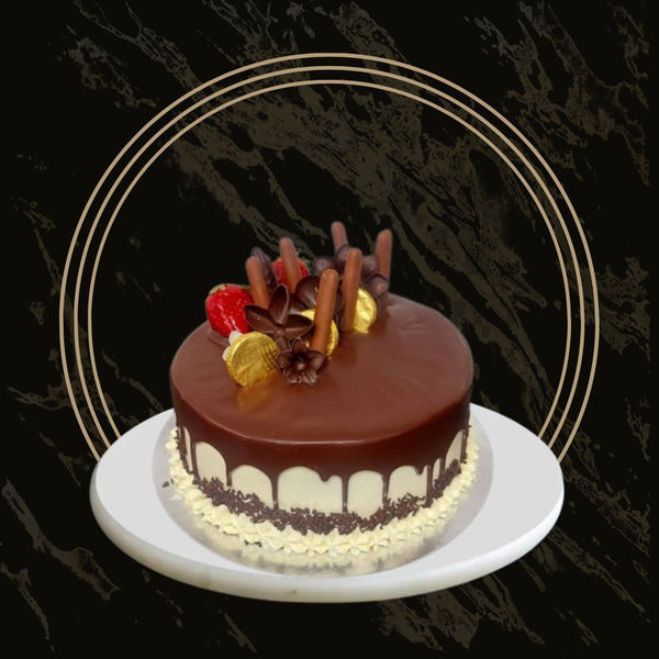 Elegant Fancy Mother’s Day cake with delicate floral designs and smooth frosting from The Bakers Shop in Birmingham