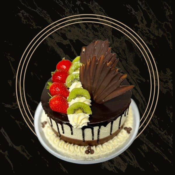 Fruit cake served with whipped cream and glazed toppings from The Bakers Shop in Birmingham