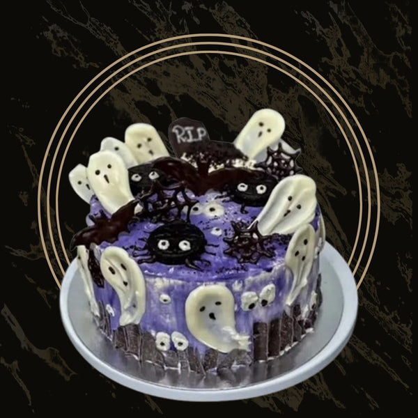 Dark chocolate Haunted Delight cake with spooky tree design and ghostly decorations from The Bakers Shop in Birmingham