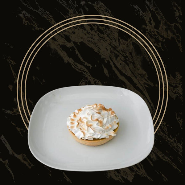 Crispy lemon meringue tarts with tangy lemon filling and fluffy meringue topping from The Bakers Shop in Birmingham