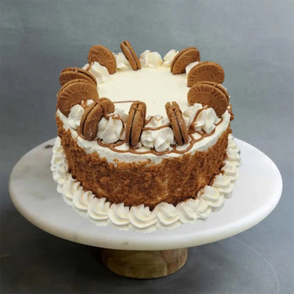 Lotus Biscoff Easter cake with cream frosting and biscuit topping from The Bakers Shop in birmingham
