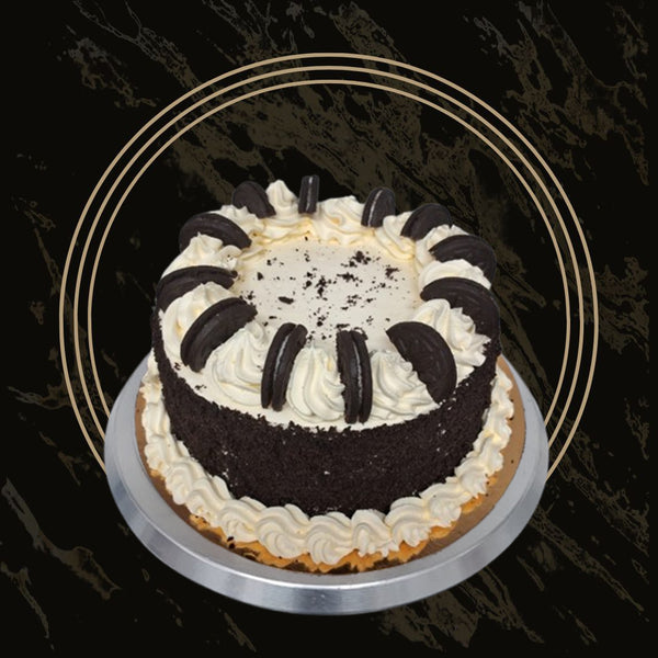 Loaded Oreo cake topped with whole cookies, chocolate chunks, and cream swirls from The Bakers Shop in Birmingham