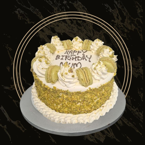 Classic pistachio cake with light sponge and nutty flavor from The Bakers Shop in Birmingham