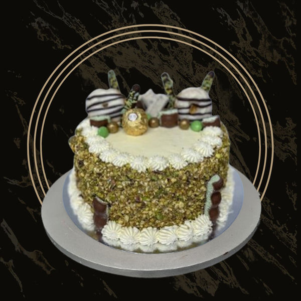 Pistachio cake with sweet glaze drizzle and nut garnish from The Bakers Shop in Birmingham