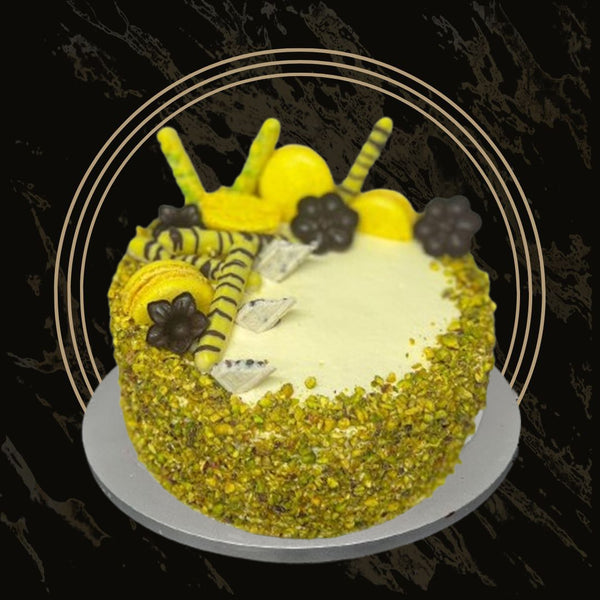 Pistachio and rose fusion cake with layered sponge and floral accents from The Bakers Shop in Birmingham