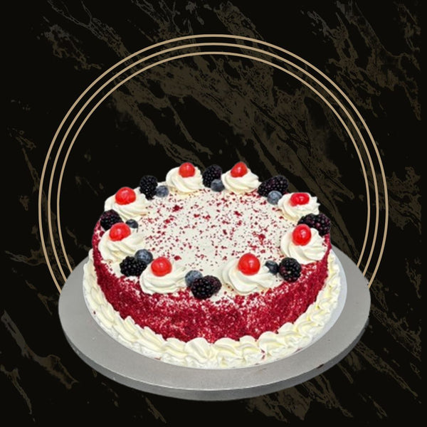 Heart-shaped red velvet cake with white chocolate drip from The Bakers Shop in Birmingha