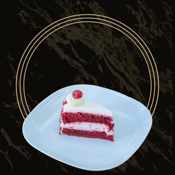 Slices of red velvet cake with cream cheese frosting from The Bakers Shop in Birmingham