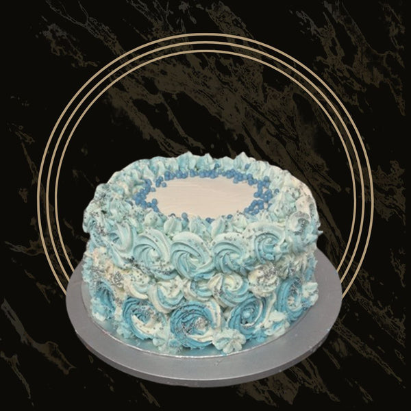 Classic vanilla cake with light, fluffy layers and smooth buttercream frosting from The Bakers Shop in Birmingham