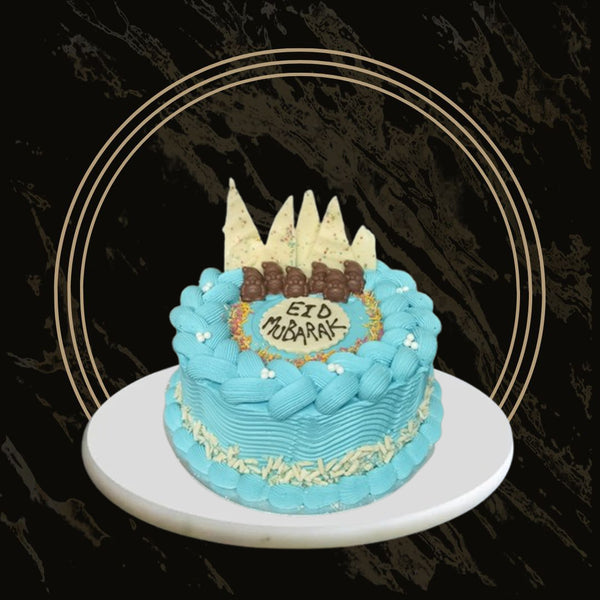 Vanilla Eid cake with smooth frosting and festive decorations from The Bakers Shop in Birmingham