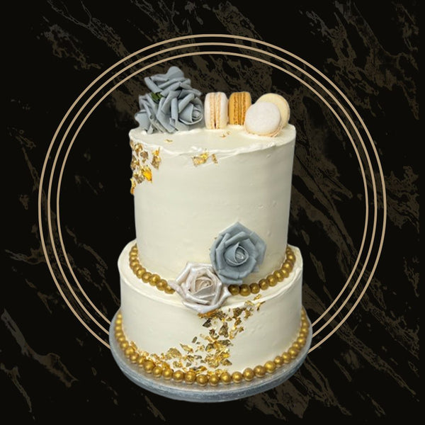 Minimalist wedding cake with gold accents and smooth fondant finish from The Bakers Shop in Birmingham