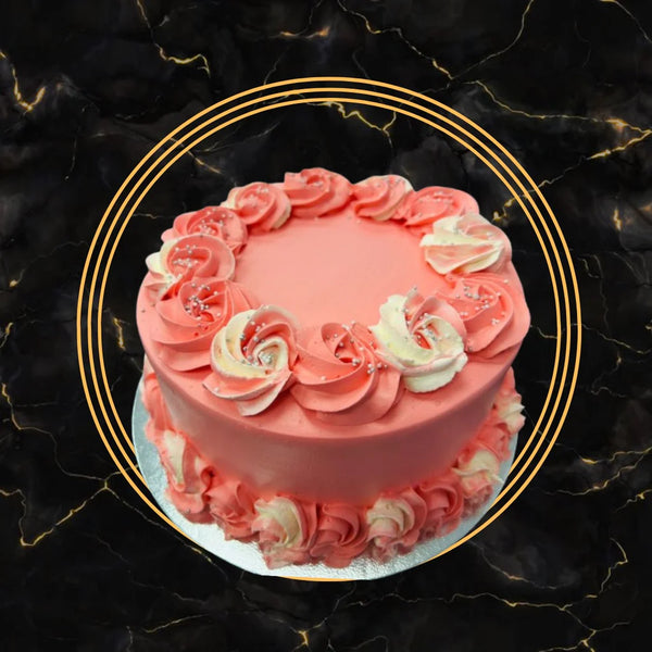 Beautiful pink fancy cake with rose-style buttercream decorations, perfect for birthdays and celebrations at The Bakers Shop Birmingham.
