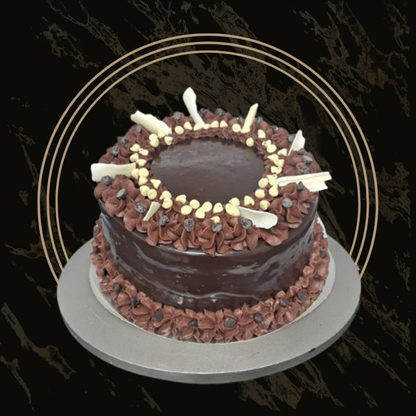 Chocolate cake with crunchy nuts and a silky chocolate ganache from The Bakers Shop in Birmingham