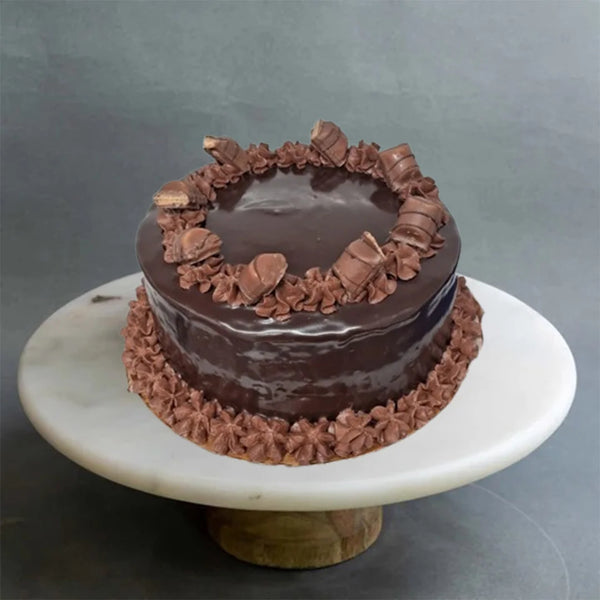 Chocolate Easter cake with rich ganache and festive toppings from The Bakers Shop in birmingham