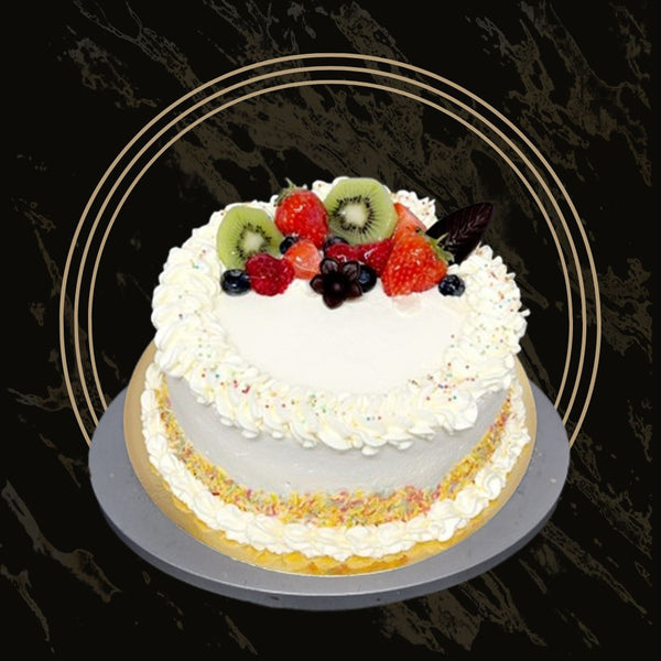 Slice of moist fruit cake filled with raisins and cherries from The Bakers Shop in Birmingham