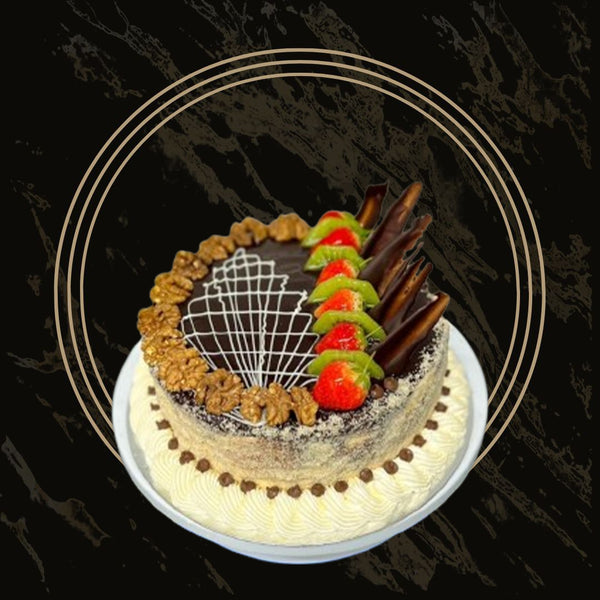 Tropical fruit cake topped with mango, pineapple, and passion fruit from The Bakers Shop in Birmingham