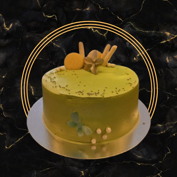 Yellow golden lotus-inspired cake with floral decorations and elegant design from The Bakers Shop Birmingham