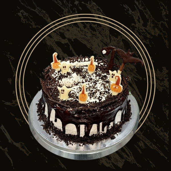 Haunted Delight Halloween cake with dark chocolate drip, tombstone toppers, and eerie frosting from The Bakers Shop in Birmingham