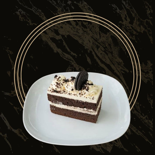 Decadent Oreo cake slices with creamy filling and crushed Oreo topping from The Bakers Shop in Birmingham