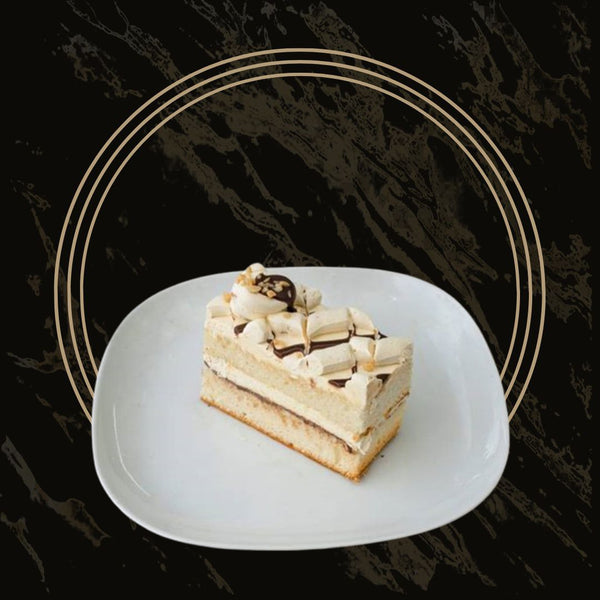Delicious peanut cake slice with a moist texture and peanut butter frosting from The Bakers Shop in Birmingham